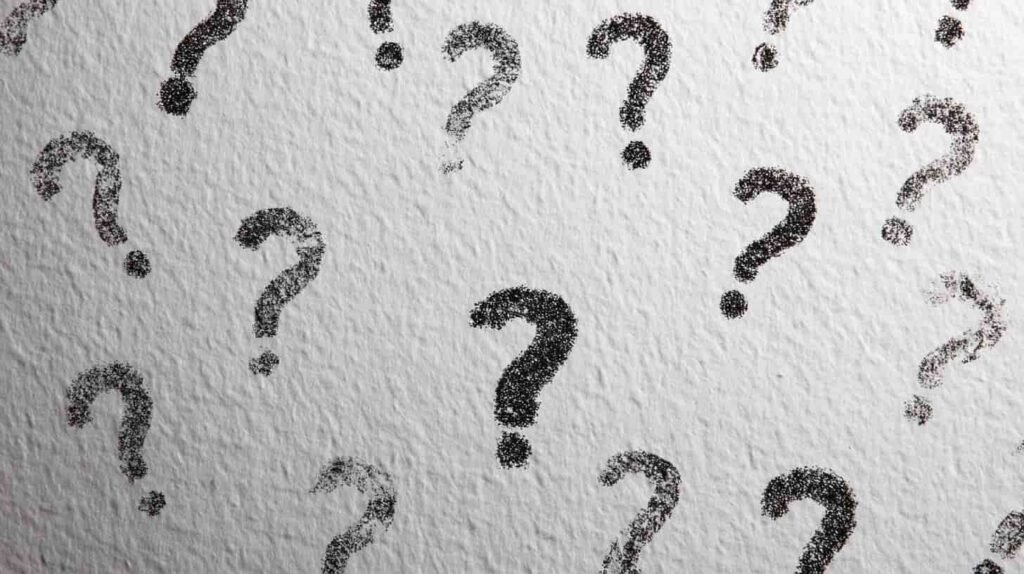 Question marks across a white background.